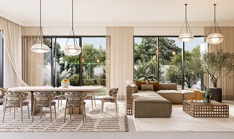 Open-plan living and dining area with garden views inside a Fairway Villas 3 home in Emaar South.