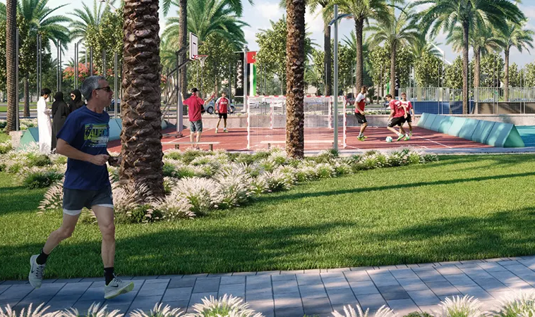Outdoor sports courts and jogging track within the Fairway Villas 3 community in Emaar South, Dubai.